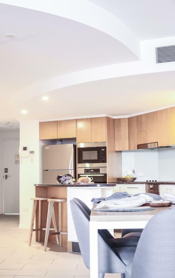 Rumba Beach Resort Caloundra Exterior photo A kitchen with a refrigerator, microwave, oven and stove
